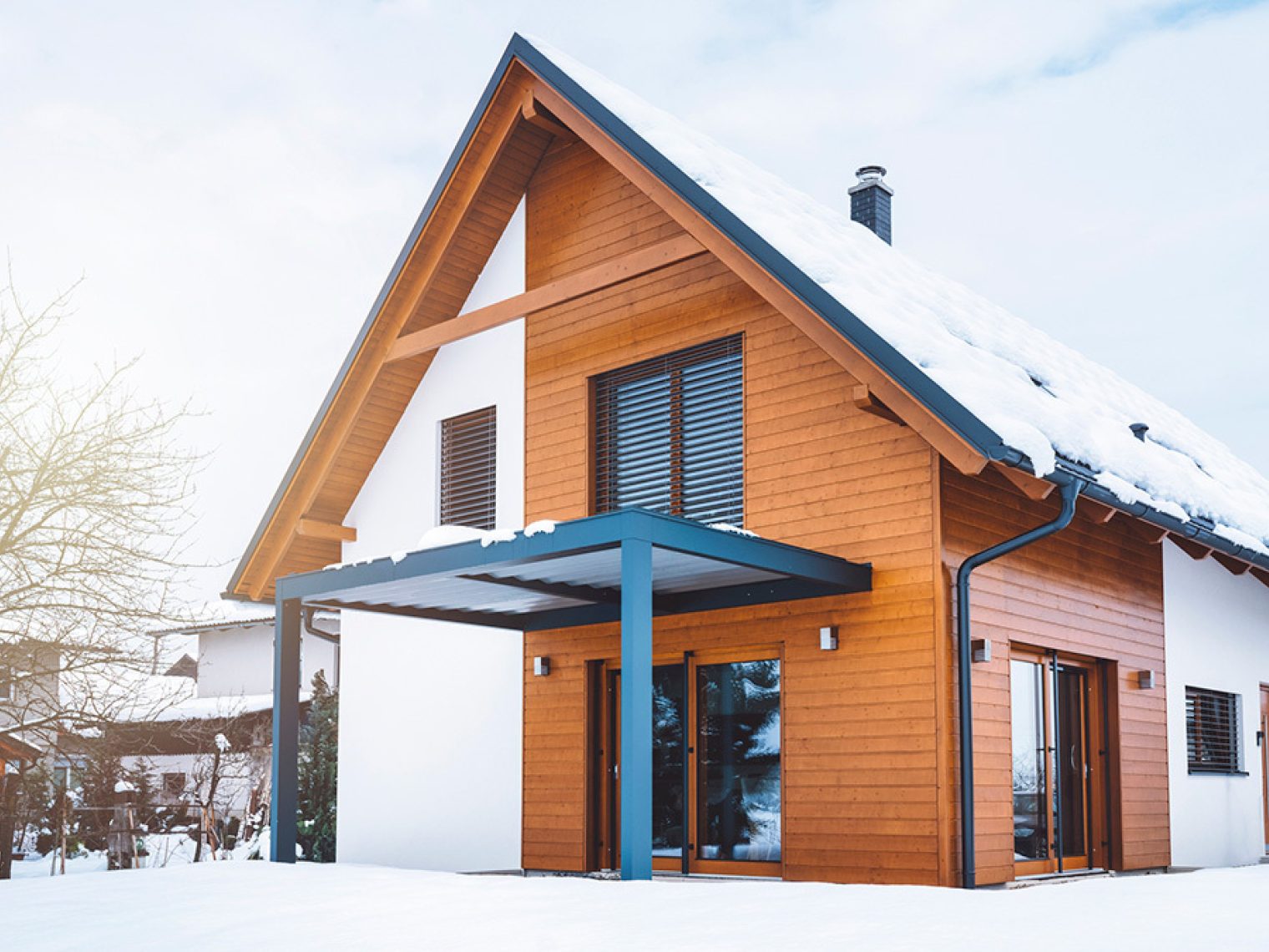 Barndominium house with snow.