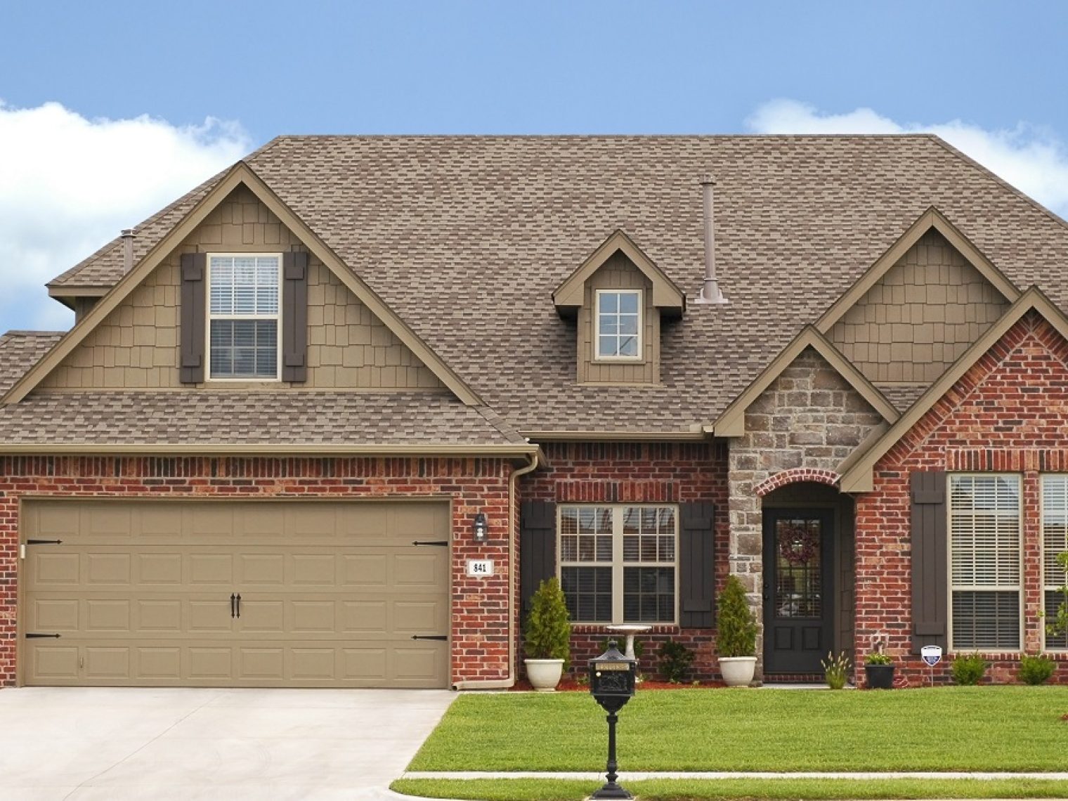 Front view of a large brick house.