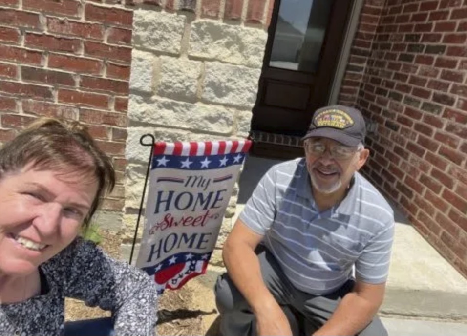 picture of Johnny M. in front of a house