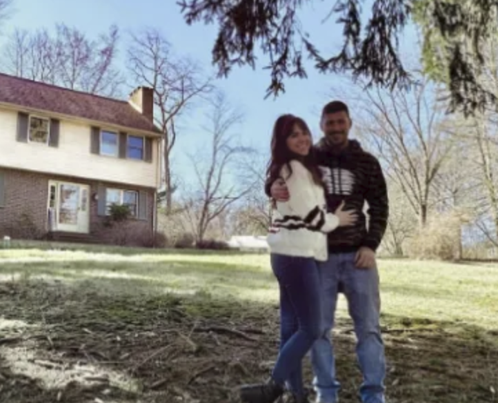 picture of Hames M. in front of a house